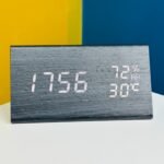 Wooden digital electronic alarm clock triangle wooden clock creative voice control LED can display temperature and humidity (BLACK)