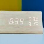 Wooden digital electronic alarm clock triangle wooden clock creative voice control LED can display temperature and humidity (WHITE)